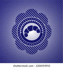 croissant icon inside badge with jean texture