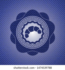 croissant icon inside badge with jean texture