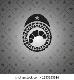 croissant icon inside black emblem
