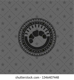 croissant icon inside black emblem