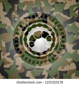 croissant icon inside camouflage texture