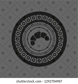 croissant icon inside dark badge or emblem