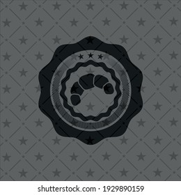 croissant icon inside dark badge or emblem. 