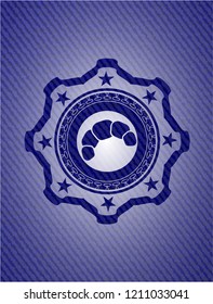 croissant icon inside denim background