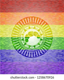 croissant icon inside emblem on mosaic background with the colors of the LGBT flag