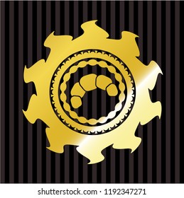 croissant icon inside golden badge