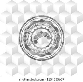 croissant icon inside grey badge with geometric cube white background
