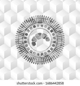 croissant icon inside grey emblem with cube white background