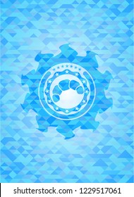 croissant icon inside light blue emblem with triangle mosaic background
