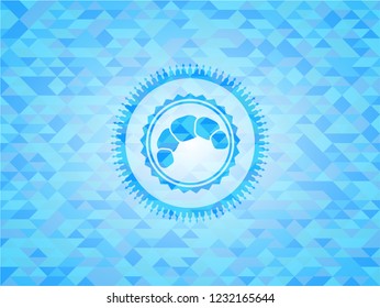 croissant icon inside light blue mosaic emblem