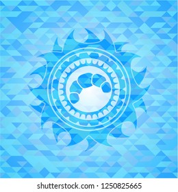 croissant icon inside light blue emblem with triangle mosaic background