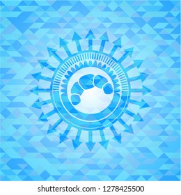  croissant icon inside light blue emblem with triangle mosaic background