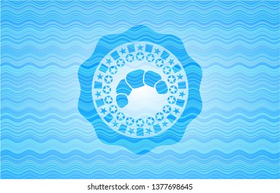croissant icon inside light blue water badge background.