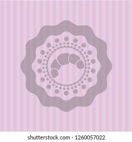 croissant icon inside pink icon or emblem