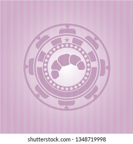 croissant icon inside pink emblem