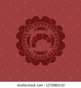 croissant icon inside red emblem