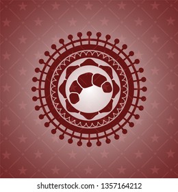 croissant icon inside red emblem