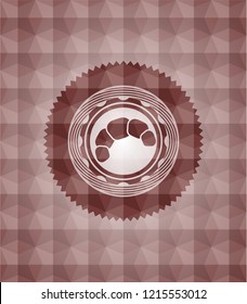 croissant icon inside red seamless emblem or badge with abstract geometric polygonal pattern background.