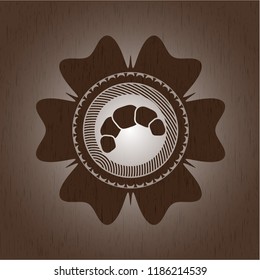 croissant icon inside retro style wood emblem