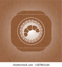 croissant icon inside retro style wood emblem