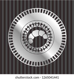 croissant icon inside silver badge or emblem
