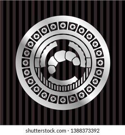 croissant icon inside silver badge