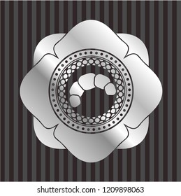 croissant icon inside silver shiny badge