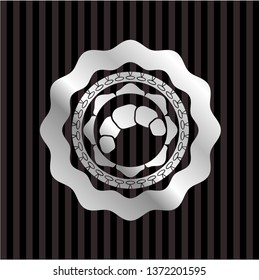 croissant icon inside silver shiny badge