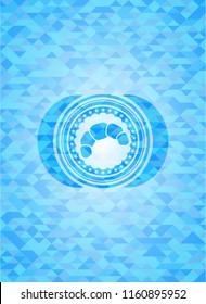 croissant icon inside sky blue emblem with mosaic ecological style background