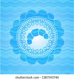 croissant icon inside sky blue water style emblem.