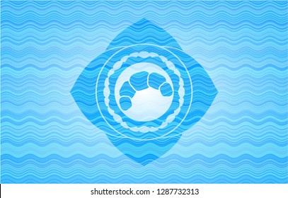 croissant icon inside water emblem background.