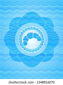 croissant icon inside water representation style emblem.