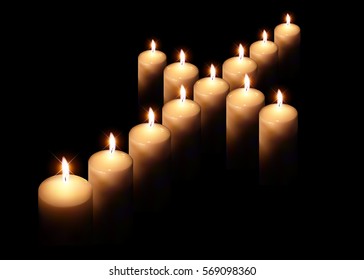 cross of burning candle on black background