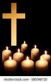 cross of burning candle on black background