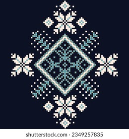 A cross stitch pattern with snowflakes on a dark blue background