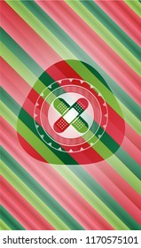 crossed bandage plaster icon inside christmas emblem background.