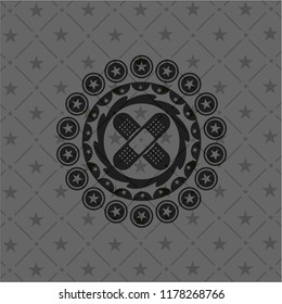 crossed bandage plaster icon inside dark emblem. Retro