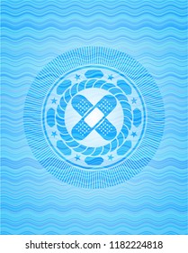 crossed bandage plaster icon inside water concept badge.
