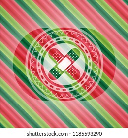 crossed bandage plaster icon inside christmas style badge..