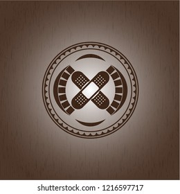 crossed bandage plaster icon inside wooden signboards