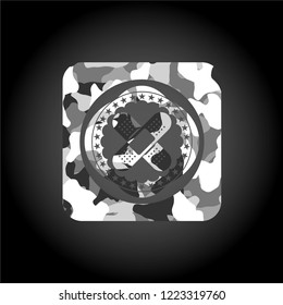 crossed bandage plaster icon inside grey camouflage emblem