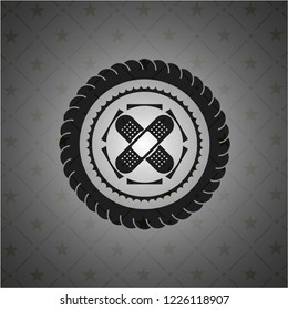 crossed bandage plaster icon inside dark emblem. Retro