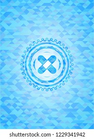 crossed bandage plaster icon inside sky blue emblem. Mosaic background