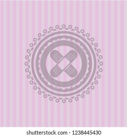 crossed bandage plaster icon inside retro pink emblem