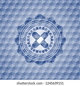 crossed bandage plaster icon inside blue badge with geometric pattern background.