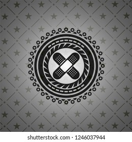 crossed bandage plaster icon inside black emblem