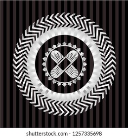 crossed bandage plaster icon inside silvery emblem