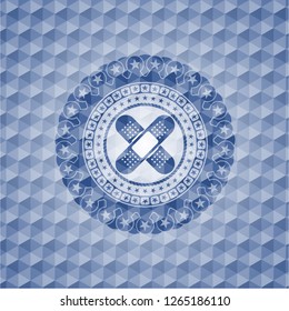 crossed bandage plaster icon inside blue badge with geometric background.