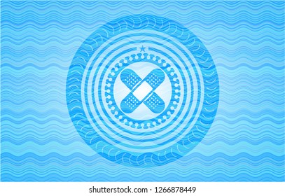 crossed bandage plaster icon inside water wavec oncept emblem.