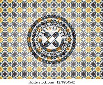 crossed bandage plaster icon inside arabesque emblem. arabic decoration.
